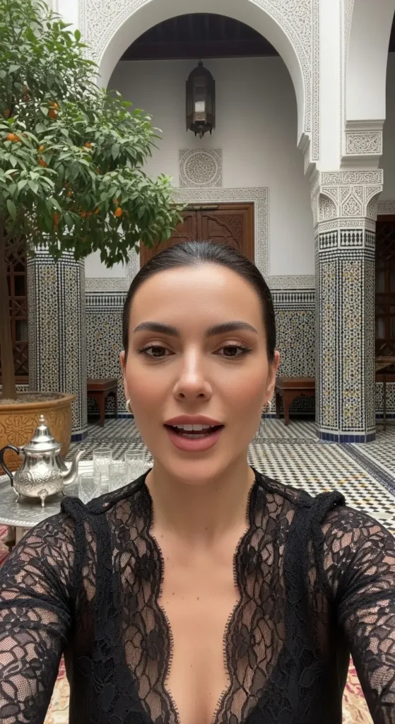 EXPLORE - Morocco's Food Made Easy: Your Simple Guide to Tagines, Couscous & More An influencer sharing a story about Morocco's food in a serene courtyard with mint tea served nearby. Morocco's food, Moroccan cuisine, travel guide, food blog, tagine recipe, couscous, pastilla, Moroccan culture, travel tips, things to do in Morocco, Moroccan street food, beginner's guide, North African food, culinary travel,